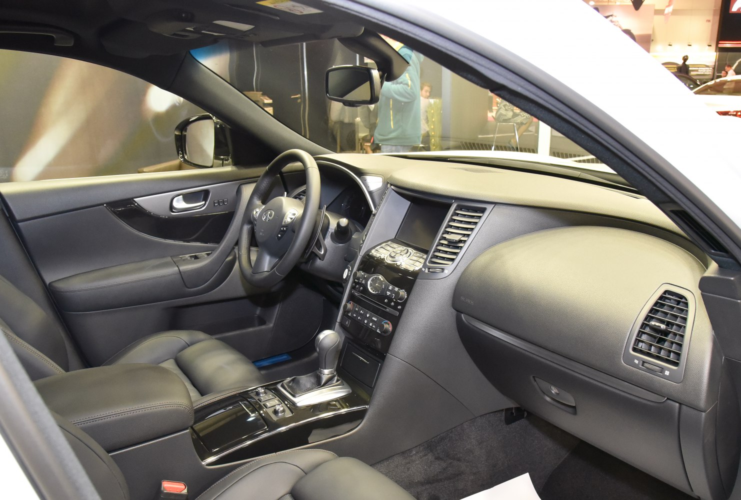 Luxury car interior with dashboard, steering wheel, center console