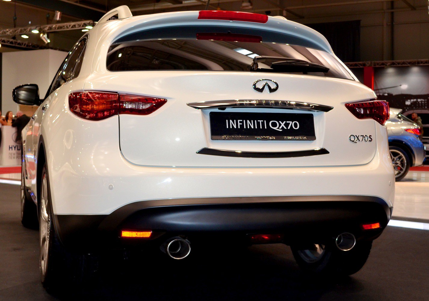 Rear view with dual exhaust and sleek taillights
