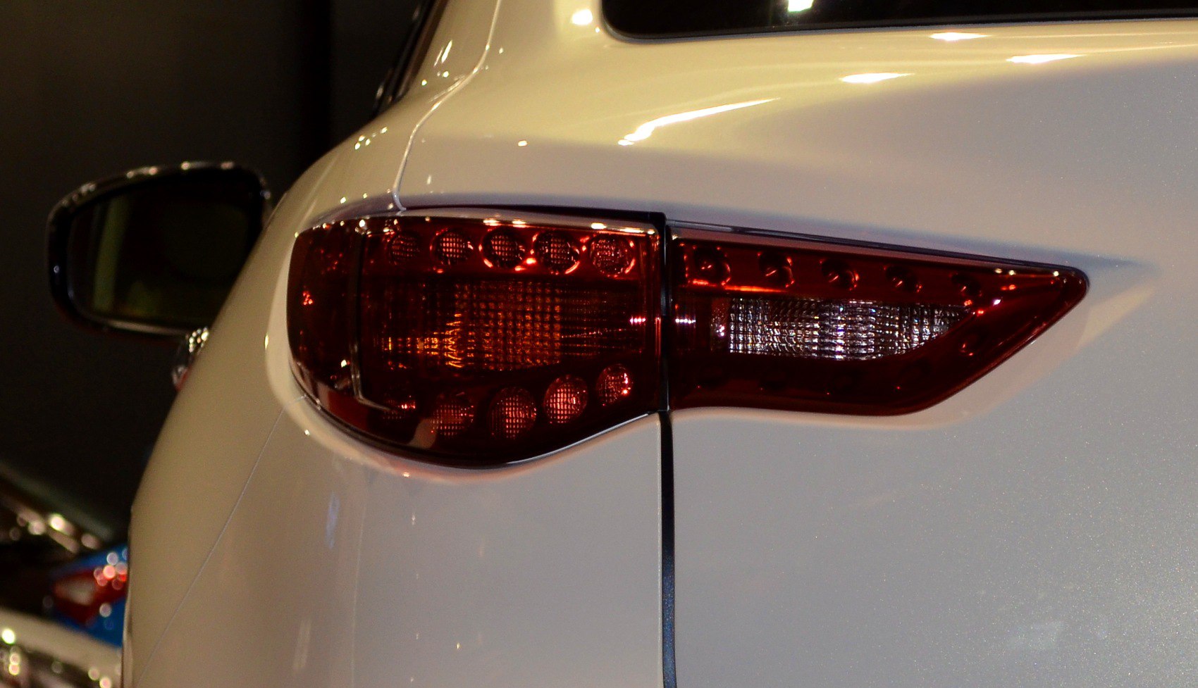 Close-up of 2014 SUV rear LED tail light and body panel.