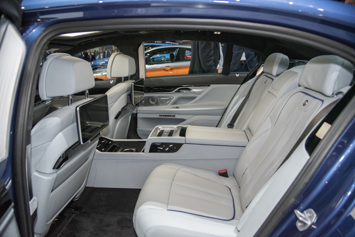 Luxury rear seats with entertainment screens and advanced center console