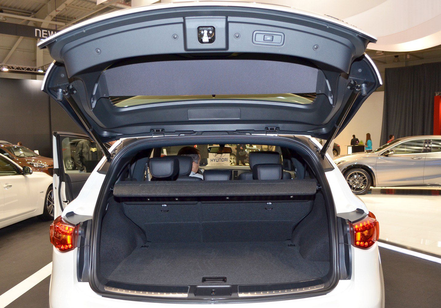 Open rear hatch with spacious trunk and cargo cover in an SUV