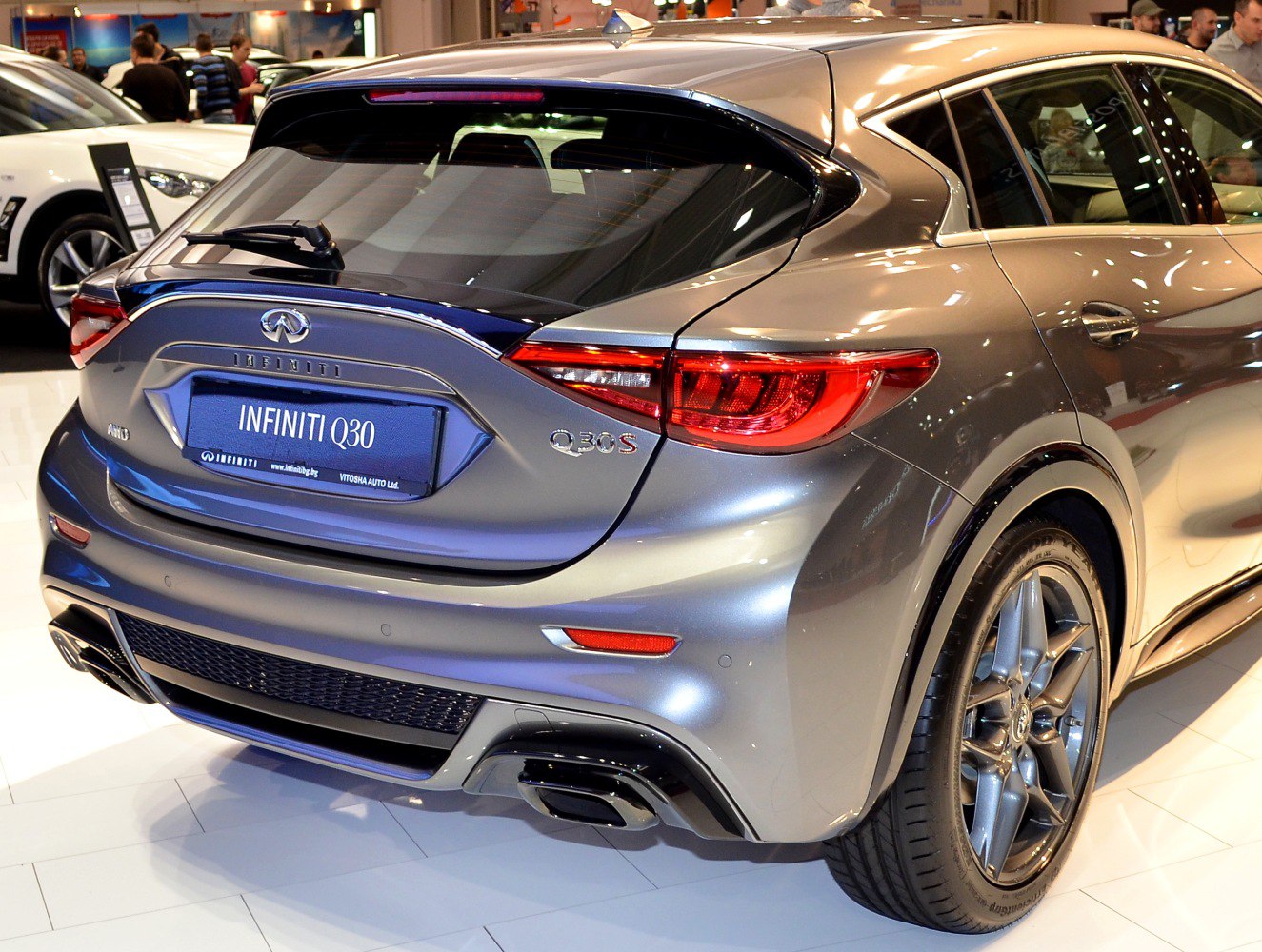 Rear and side view of a hatchback with sporty taillights and dual exhaust
