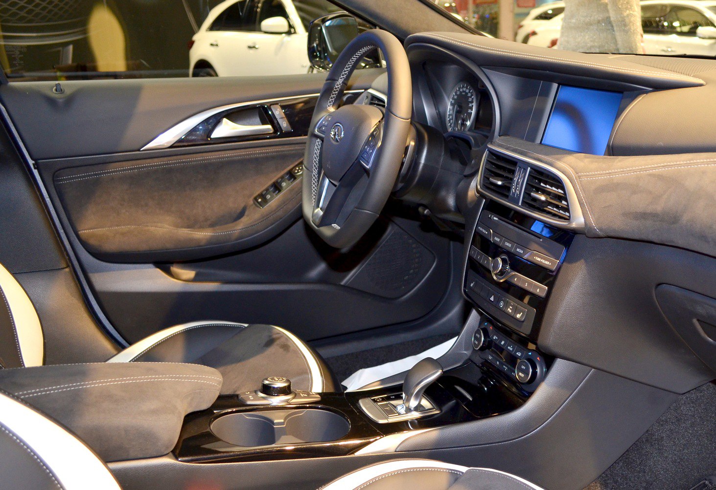 Modern car interior with dashboard, steering wheel, and center console