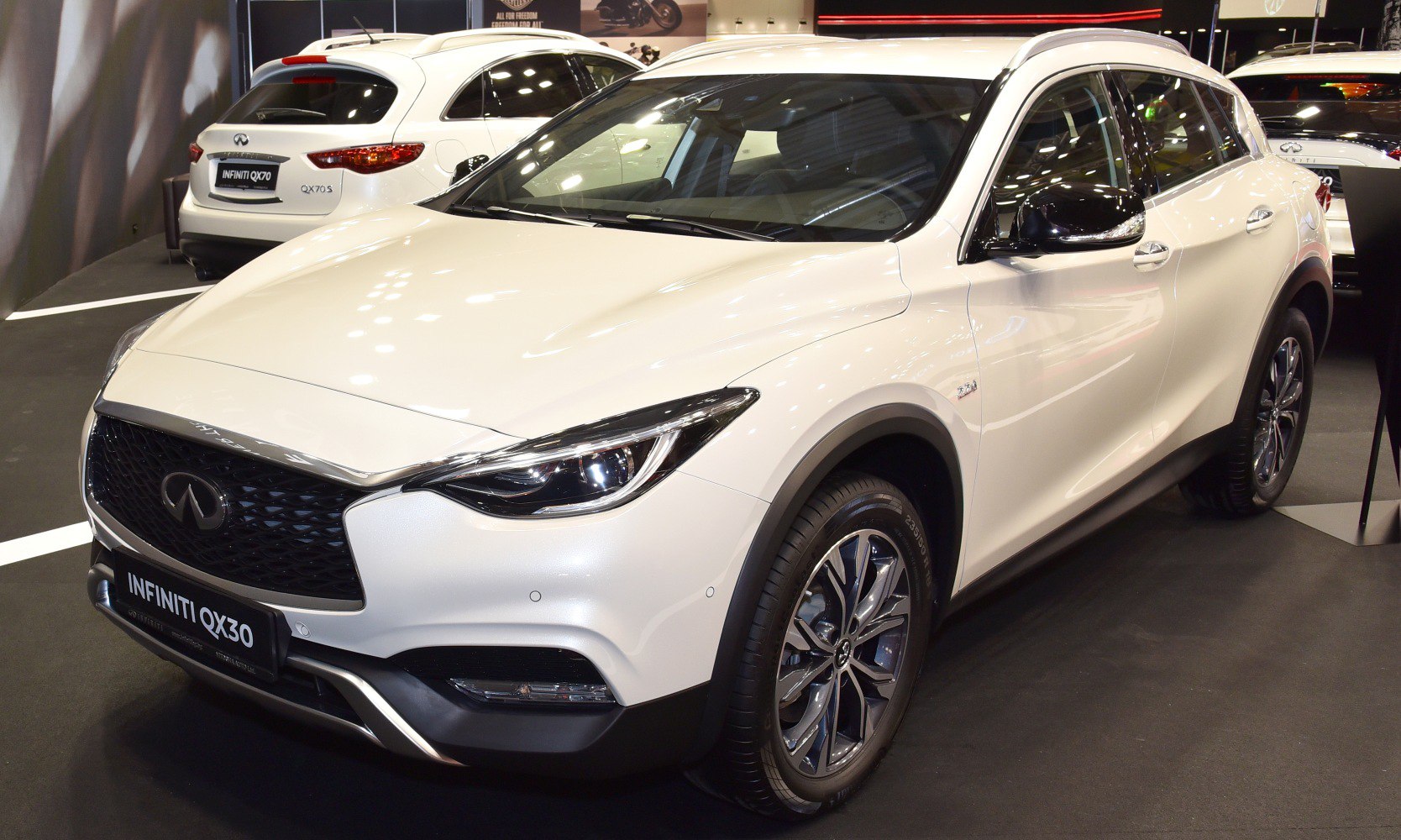 Sleek front design with prominent headlights and grille