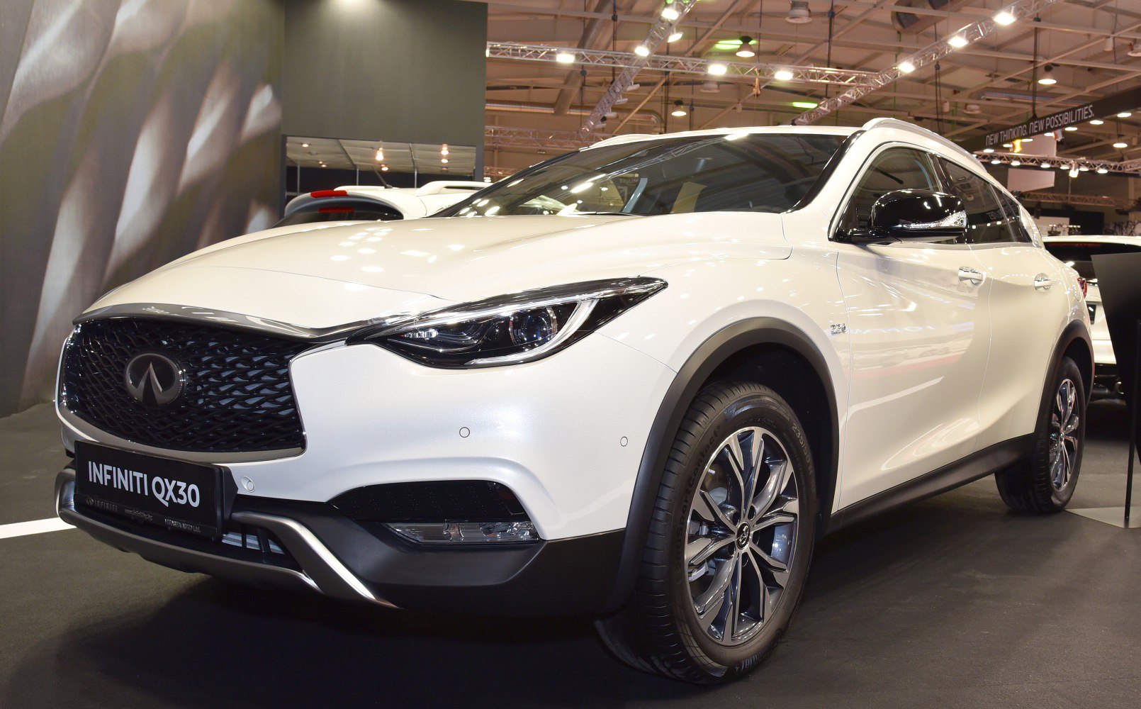 Front angle view with LED headlights and alloy wheels