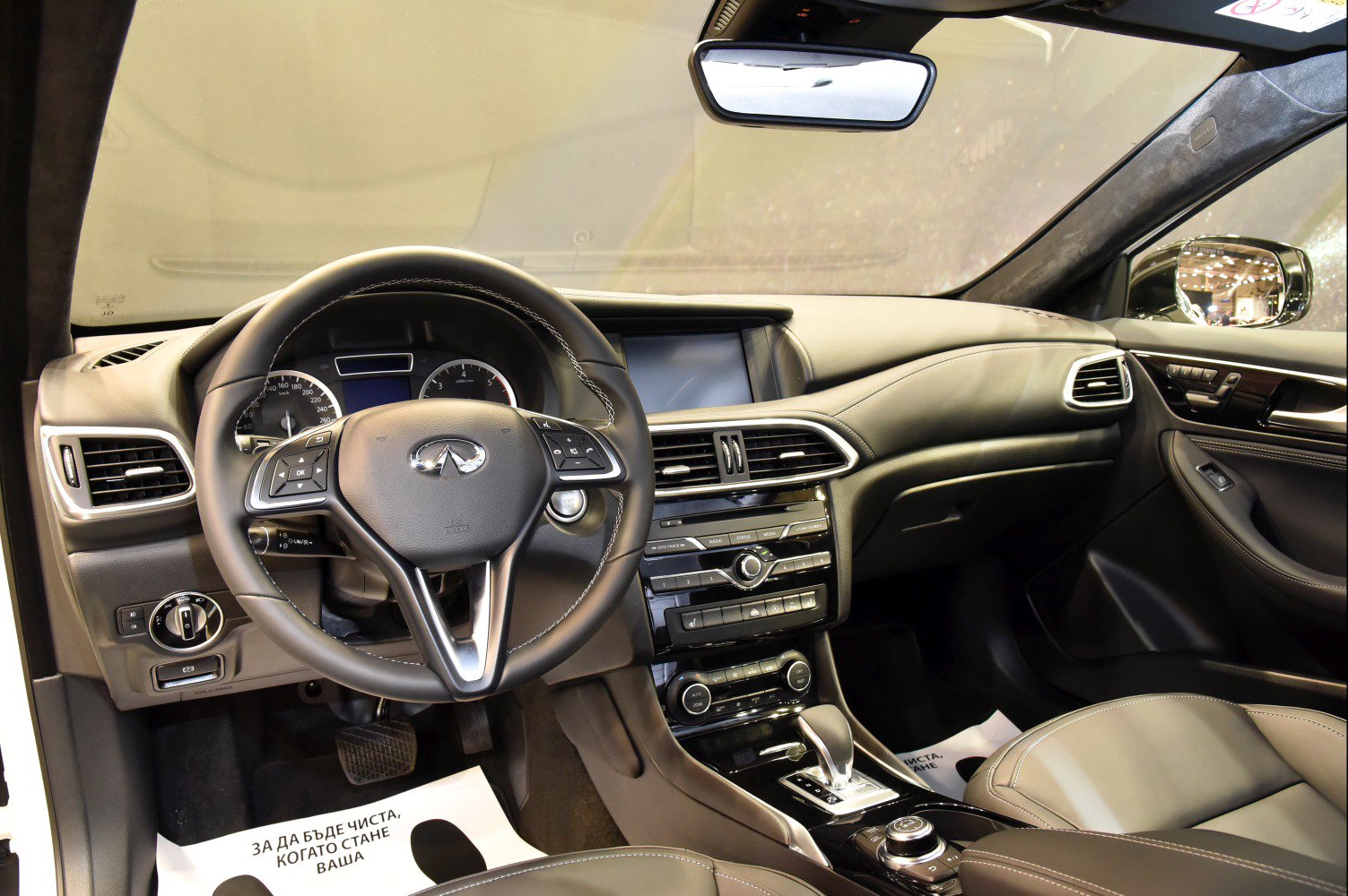 Dashboard and steering wheel with control buttons and instrument cluster