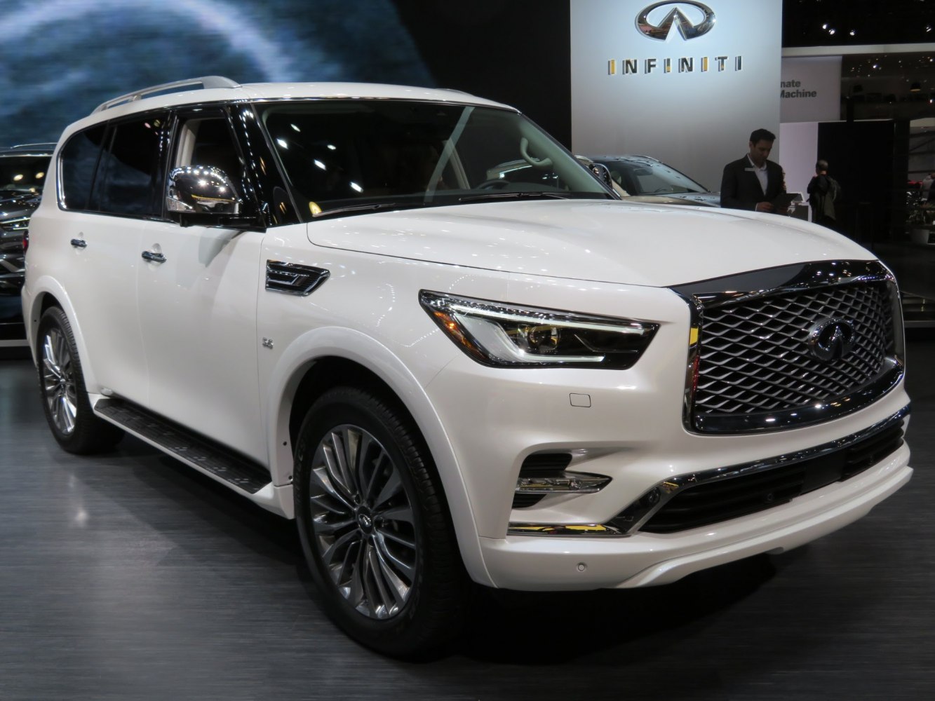 Luxury SUV front with large grille and LED headlights