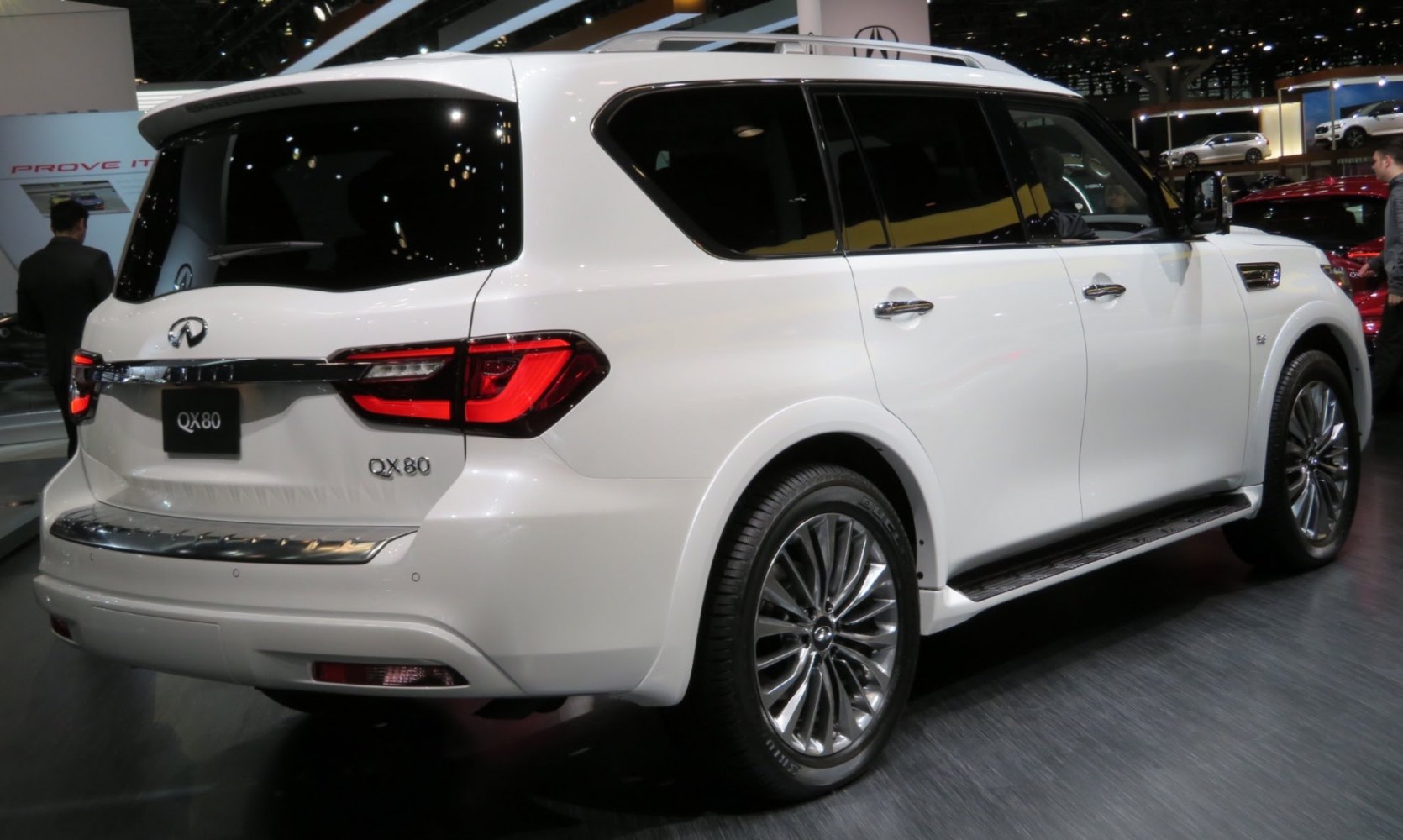 Rear and side view of large luxury SUV with distinctive tail lights and alloy wheels