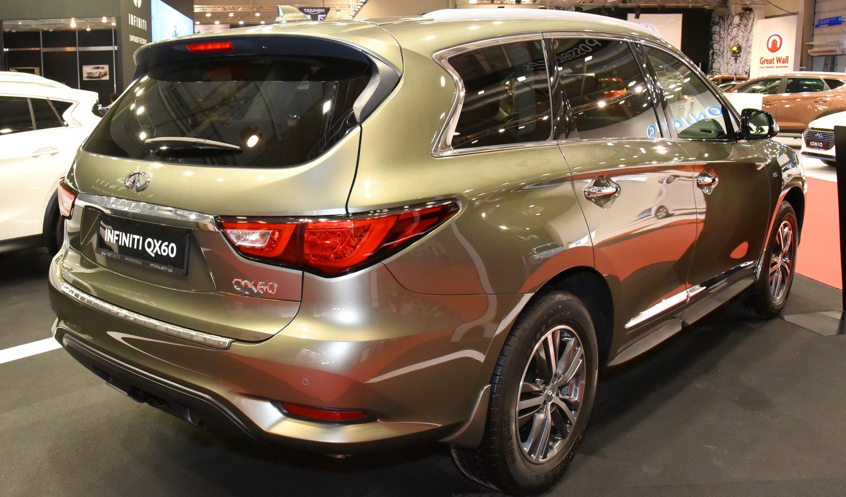Rear view with distinctive tail lights and rear window wiper
