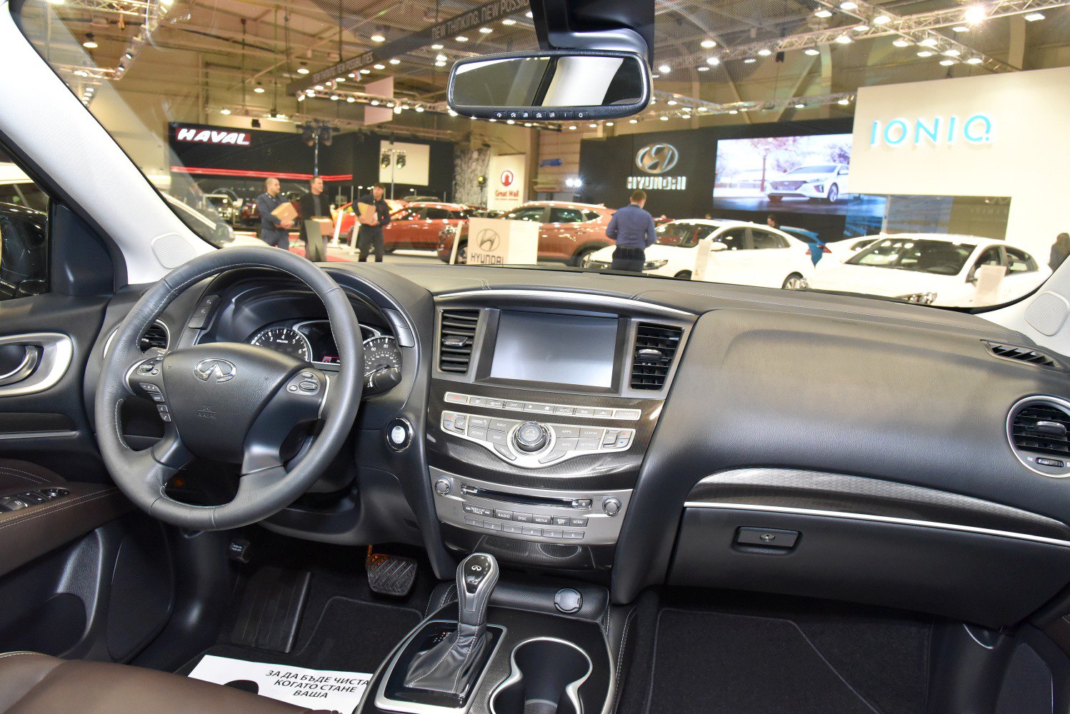 Interior dashboard and steering wheel with center console and gear shifter