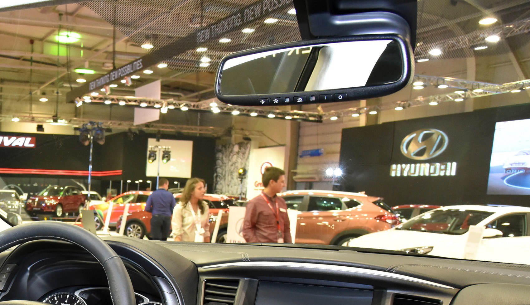 Dashboard, steering wheel, and rearview mirror interior view of vehicle