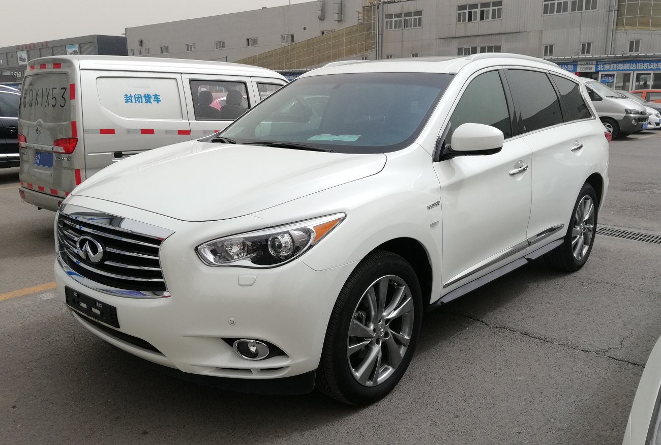 Front side view with chrome grille and sleek headlights