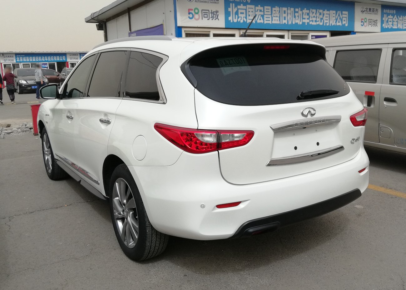Rear view with distinctive taillights and tinted windows