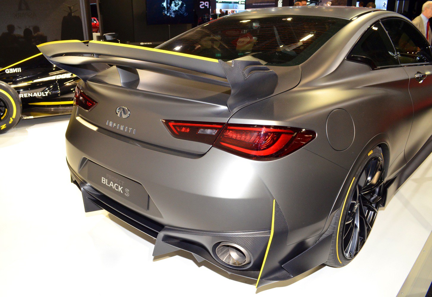 Rear wing and dual exhaust with carbon fiber elements