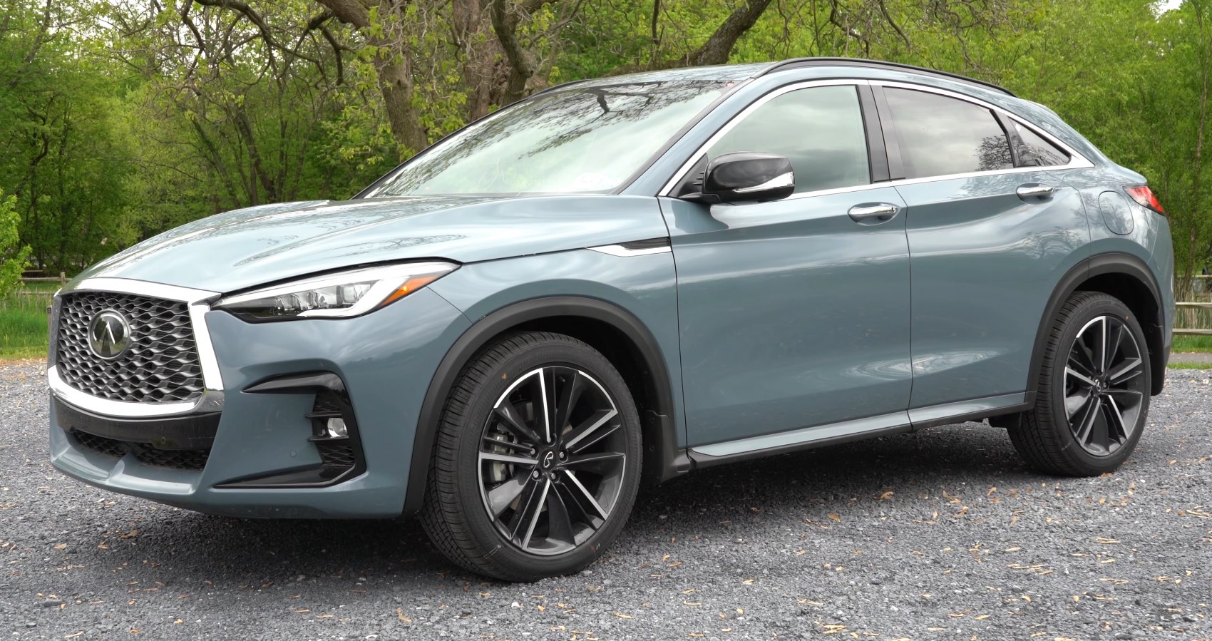 Front and side view with sharp headlights and signature grille