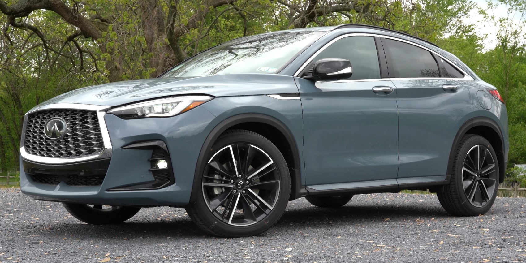 Front side view of a crossover with sleek grille and large alloy wheels