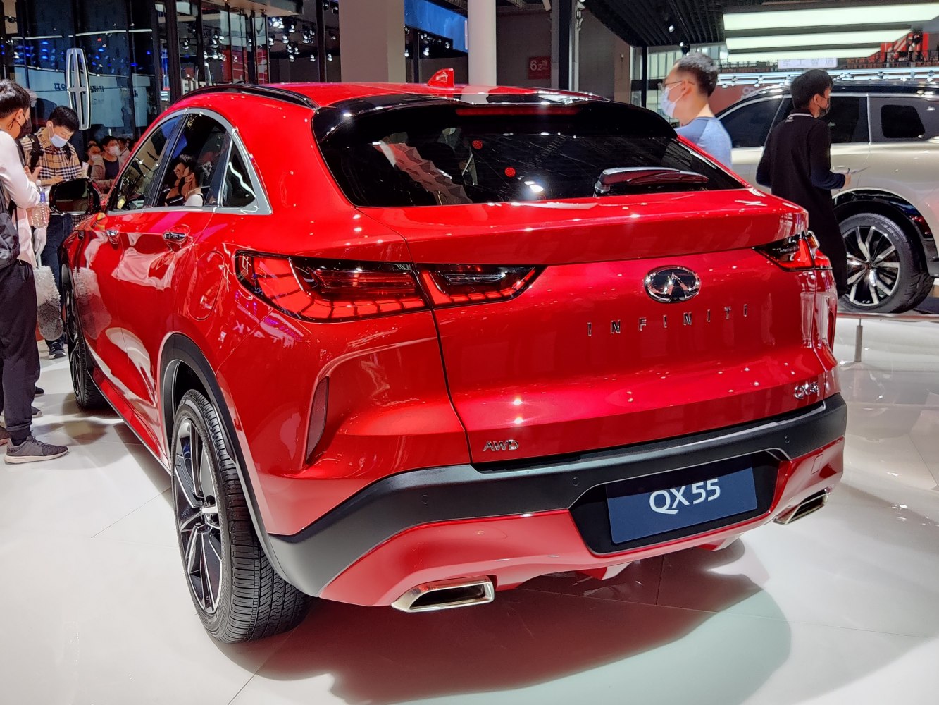 Red AWD SUV rear with sleek tail lights and dual exhausts