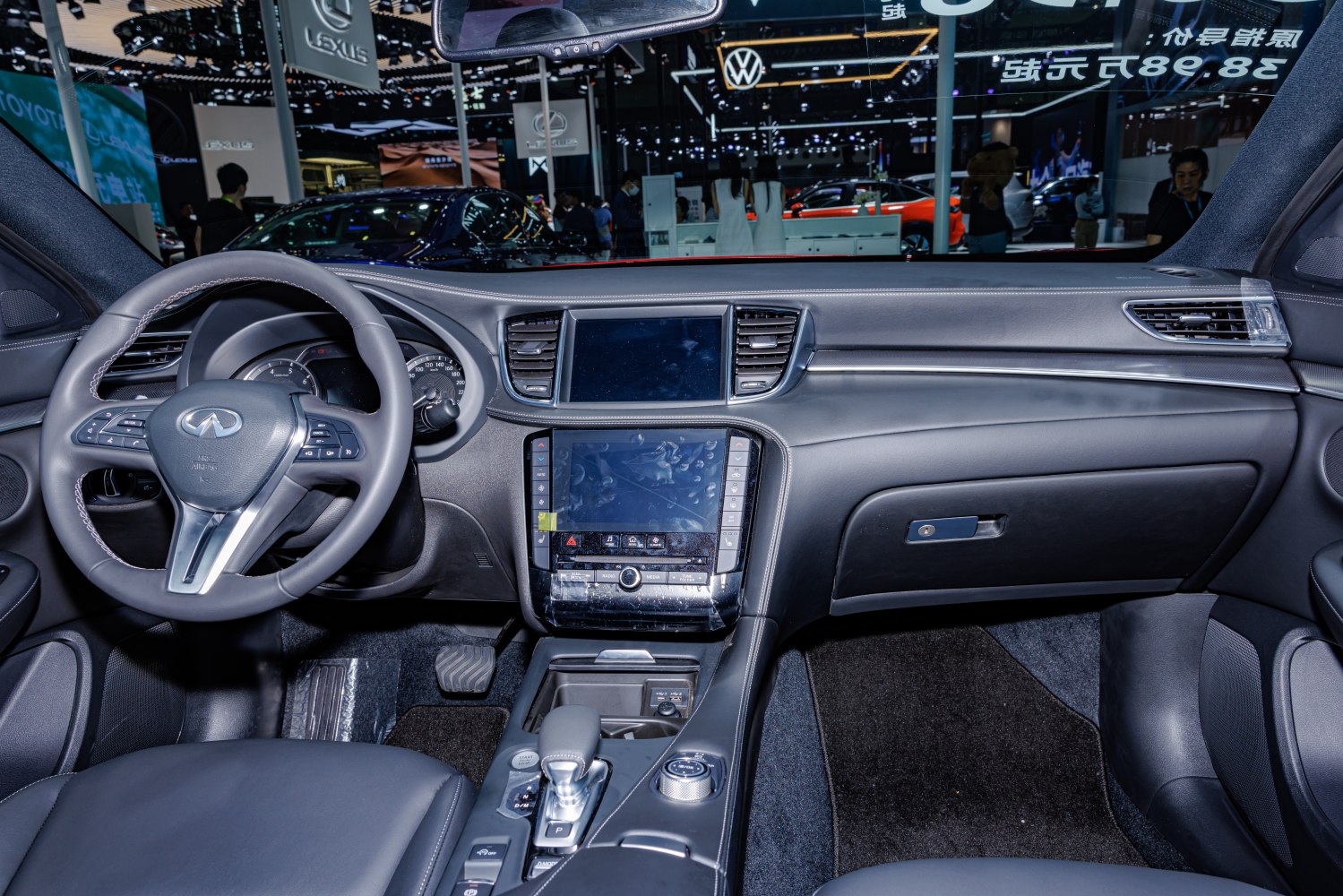 Interior dashboard with dual touchscreens and multifunction steering wheel