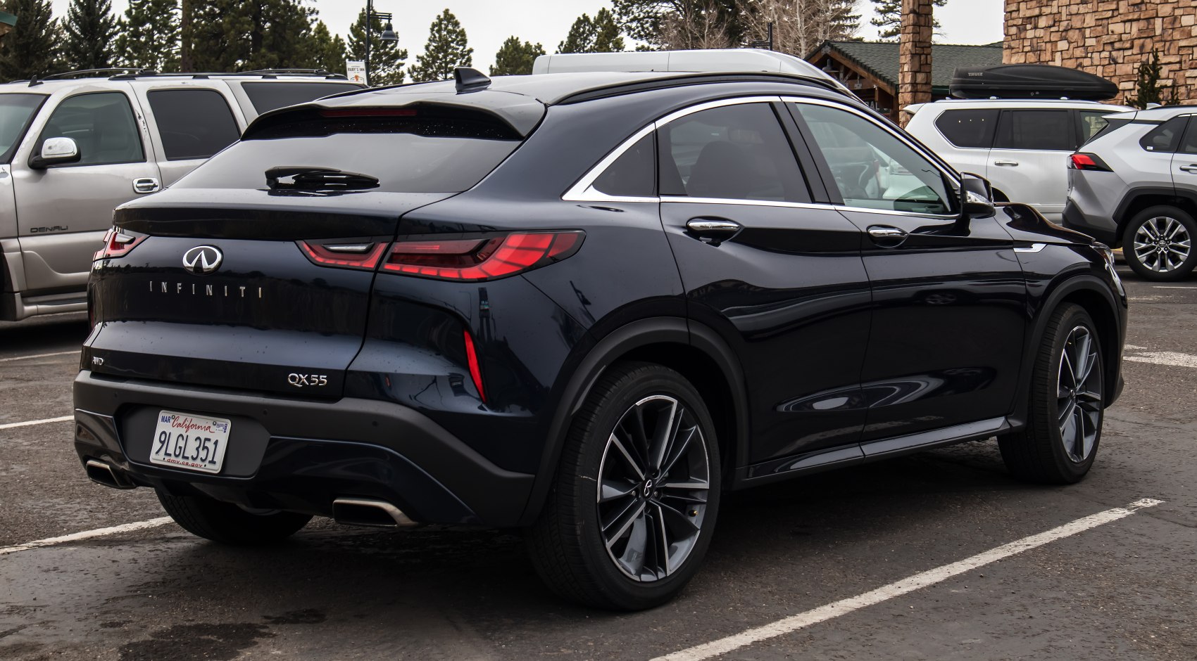 Black premium SUV rear side with sleek taillights and sporty alloy wheels