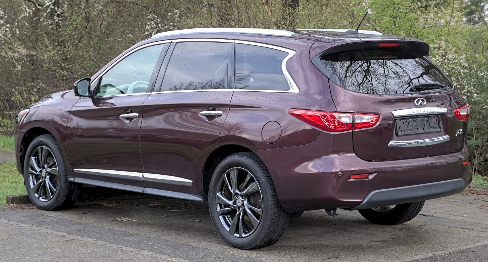 Sleek SUV rear with black alloy wheels and tinted windows