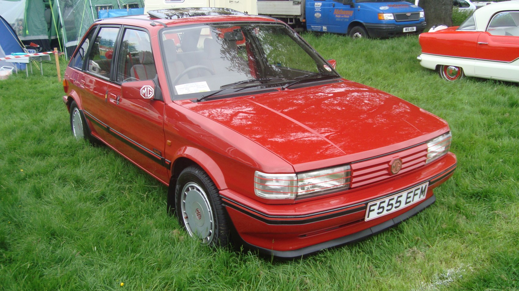 Front and side view of a classic 1980s boxy hatchback with distinctive grille and wheel design