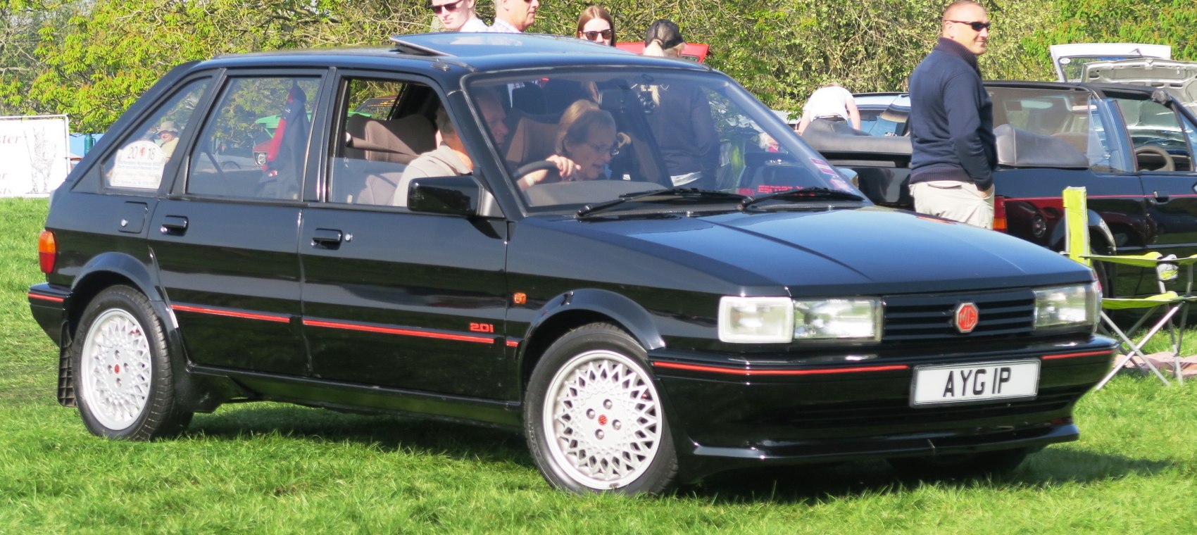 Black 1980s hatchback with distinctive alloy wheels and angular design.