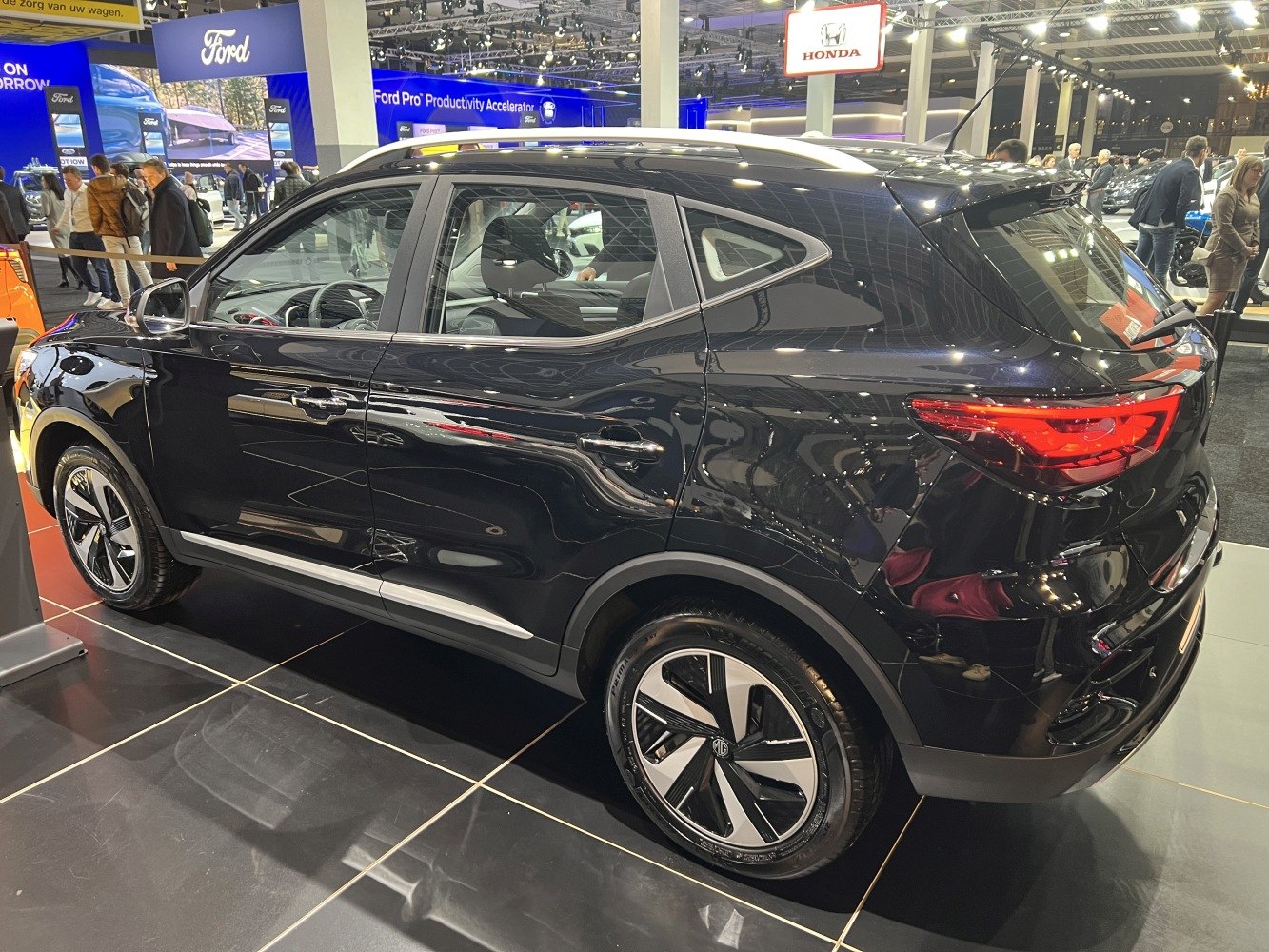 Rear side profile with alloy wheels and modern taillights