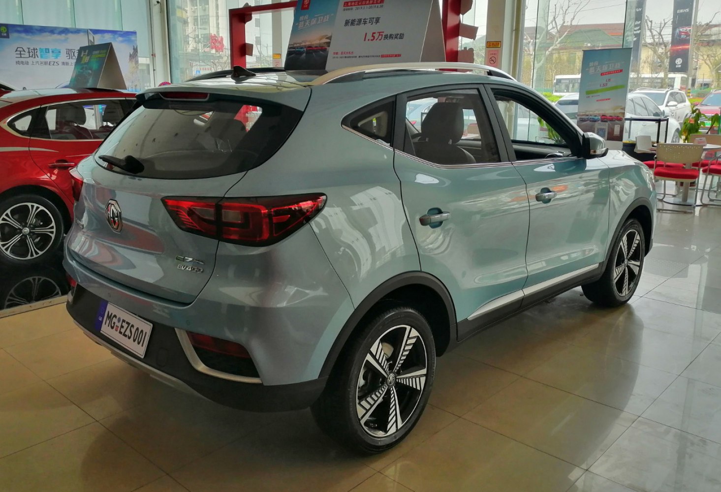 Rear and side view of electric SUV, showing taillights, alloy wheels, and roof rails
