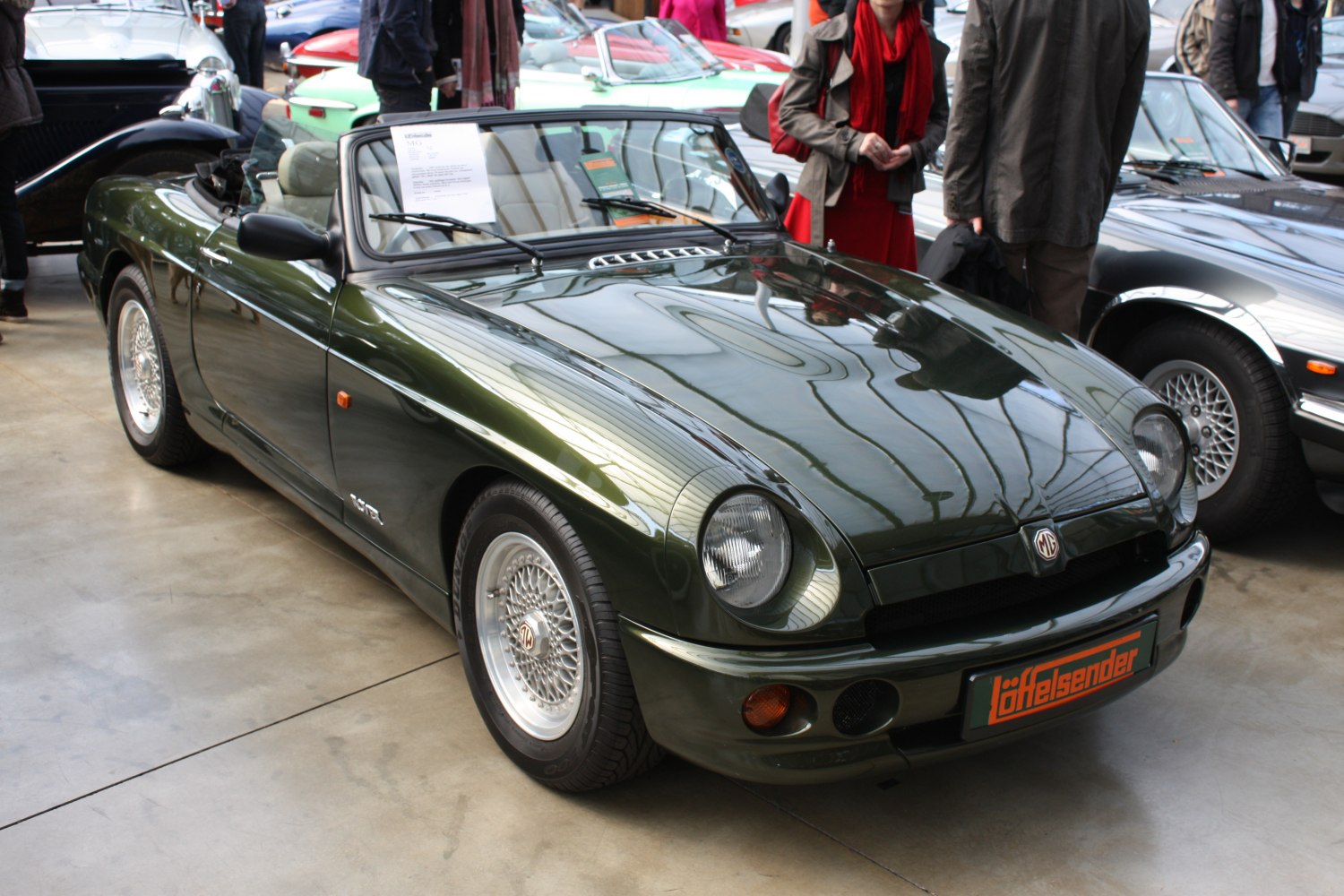 Convertible roadster with wire spoke wheels and pop-up headlights