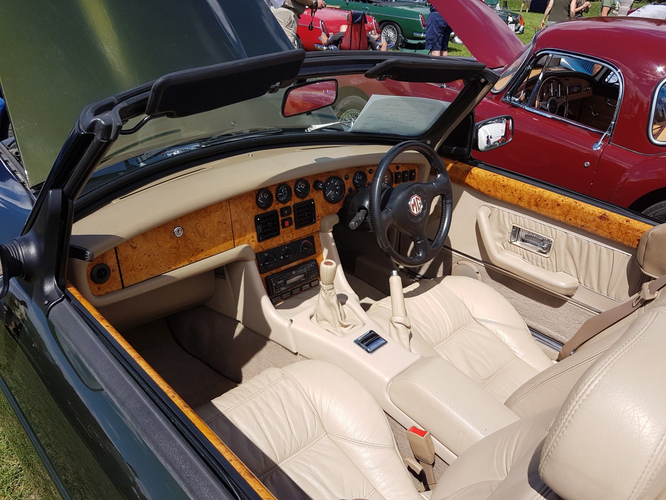 Convertible interior with wood trim and beige leather seats