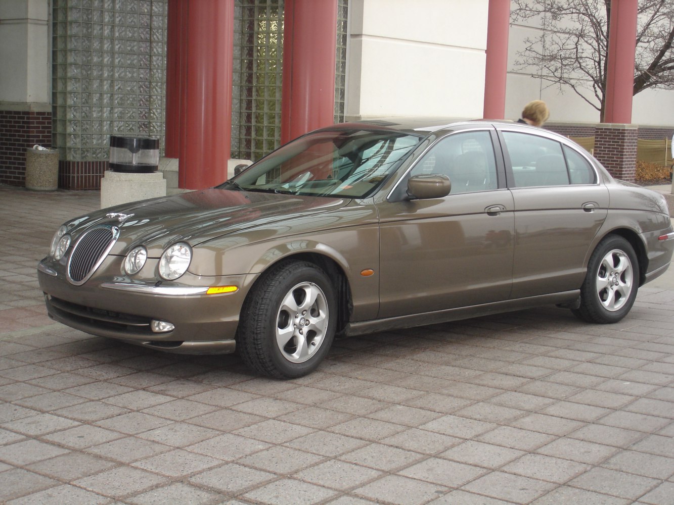 Oval chrome grille and four round headlights on classic luxury sedan