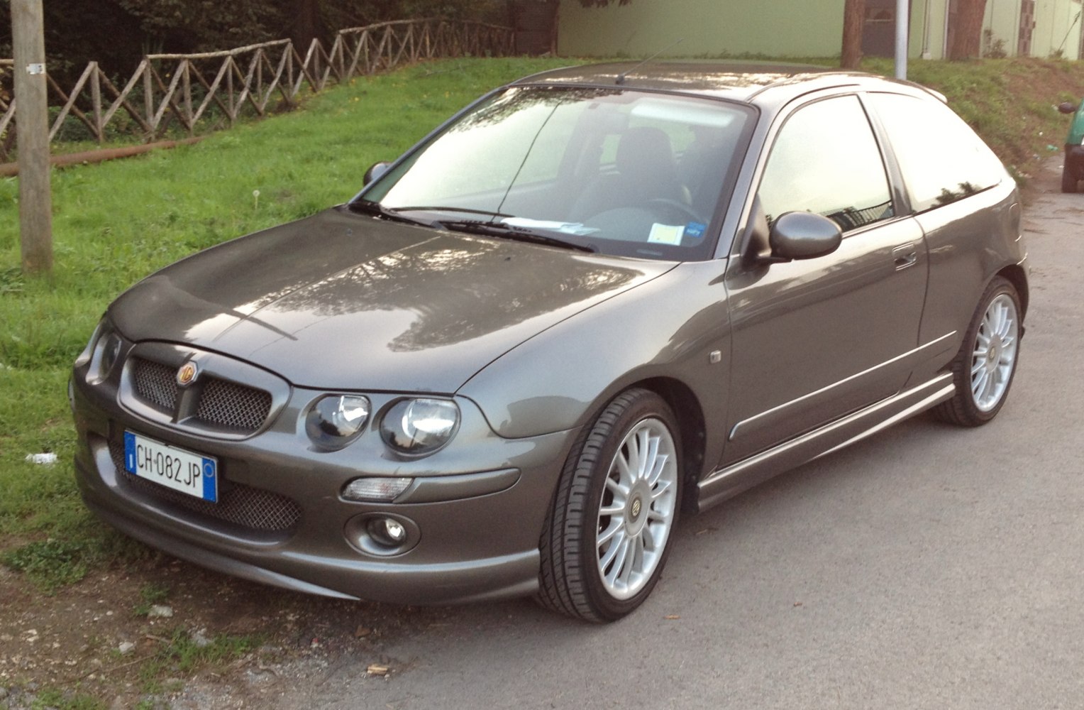 Front three-quarter view of a compact hatchback with prominent grille and alloy wheels
