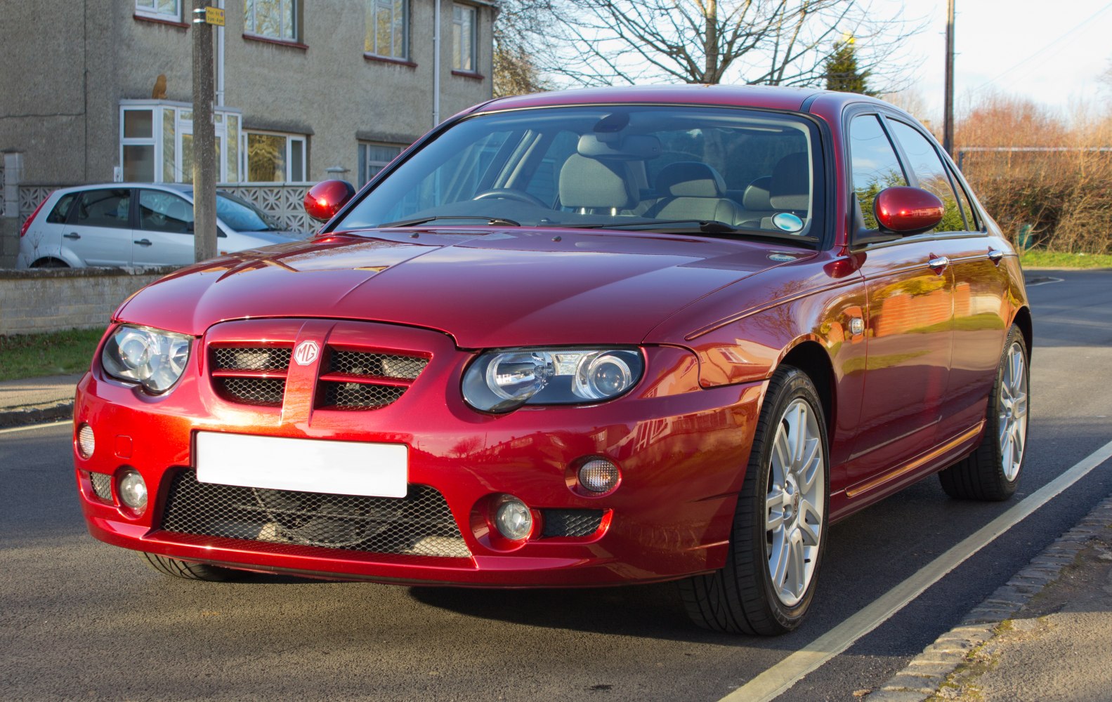 Front view with grille and headlights of a red car