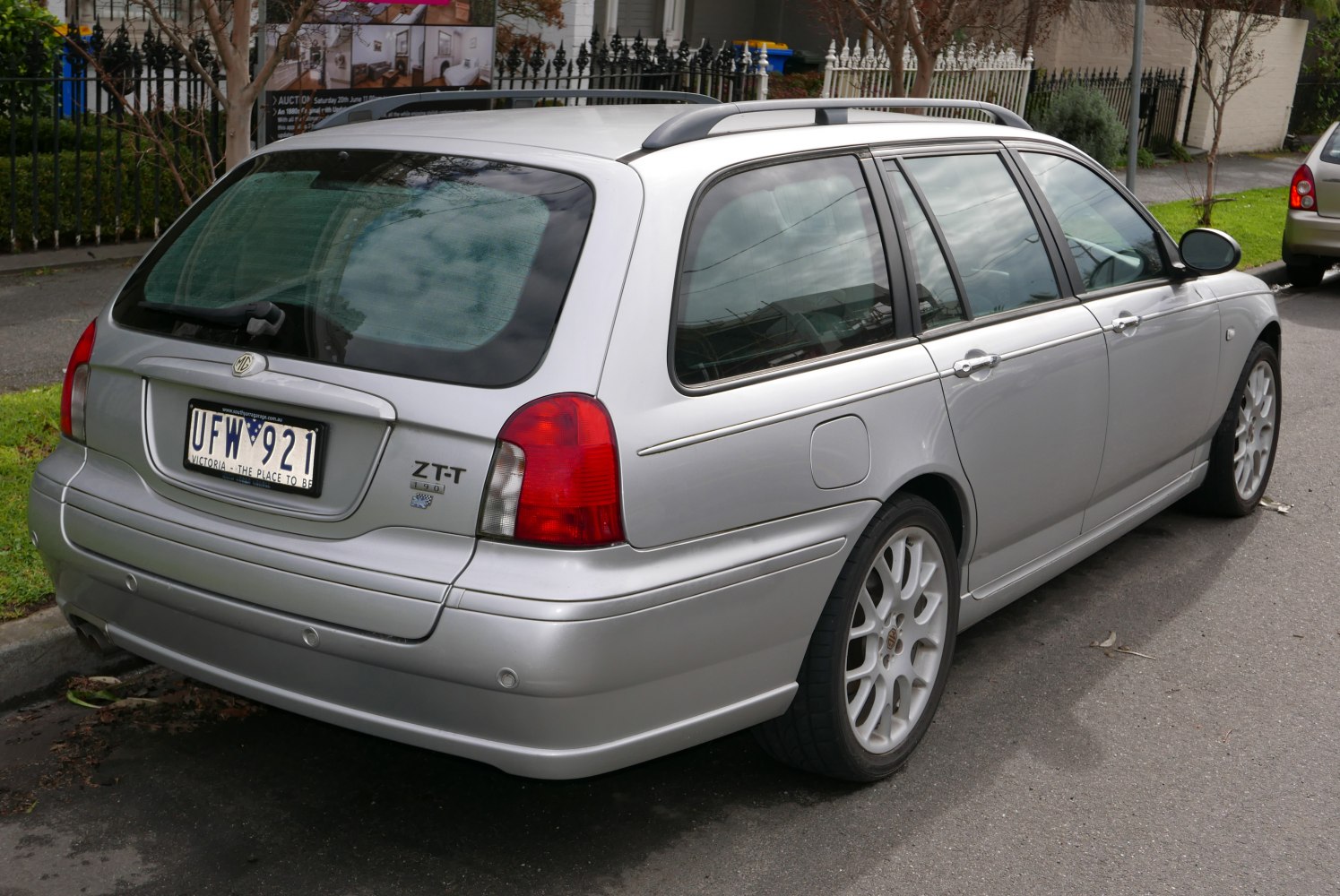 Silver estate car rear and side with roof rails and alloy wheels
