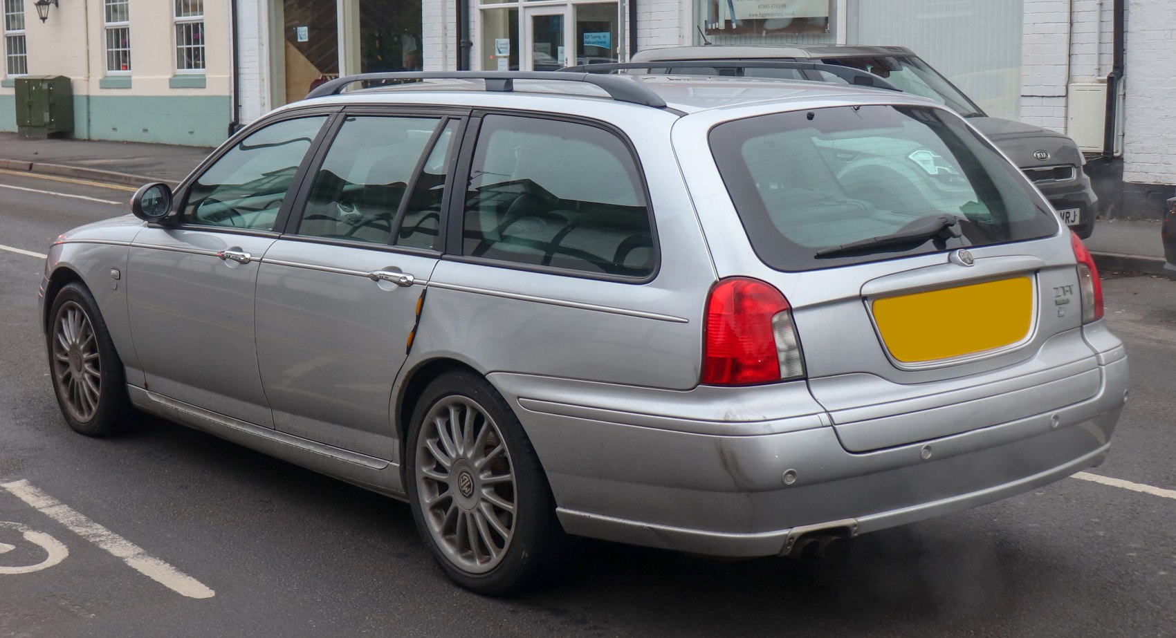 Silver station wagon with roof rails and alloy wheels