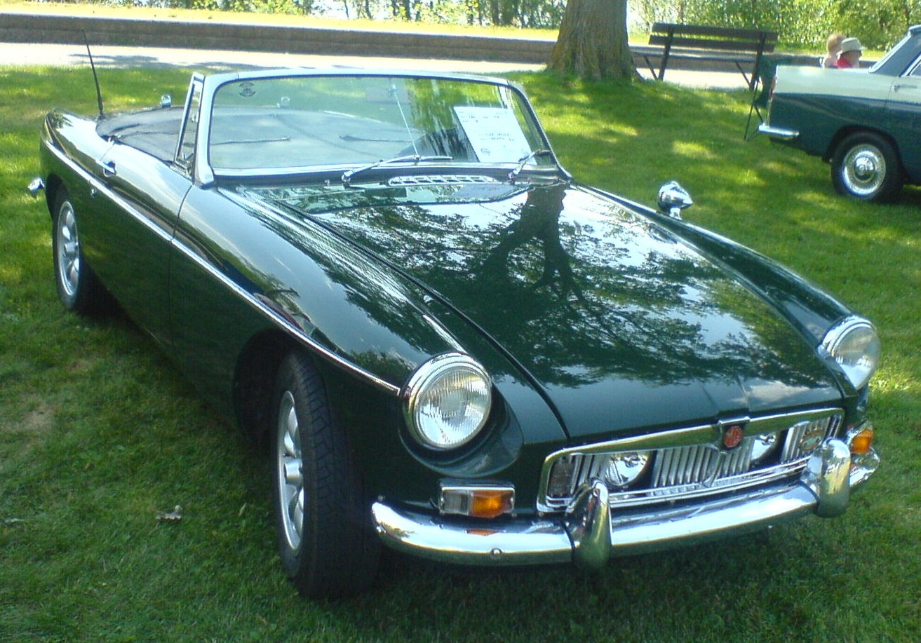 Vintage convertible with chrome grille and round headlights
