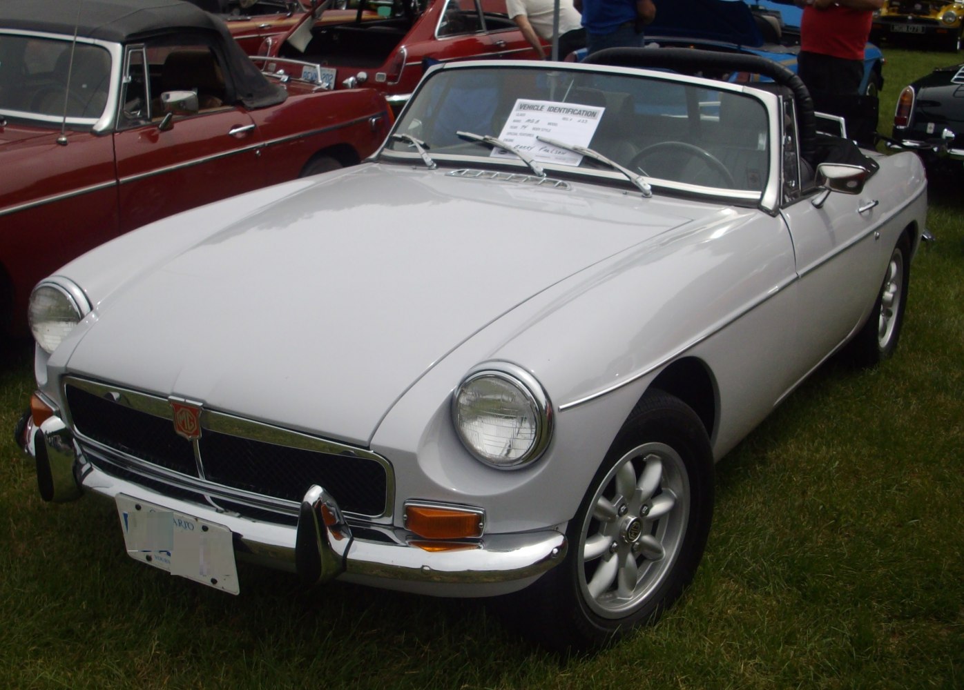 Classic convertible with round headlights and chrome bumper