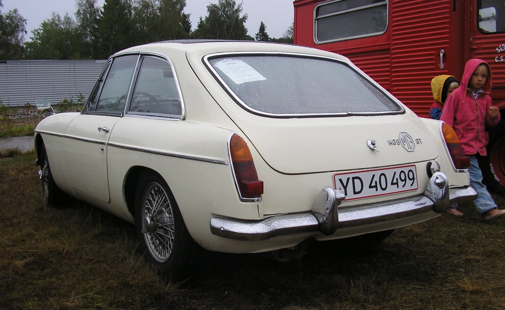 Vintage two-door coupe with wire wheels and chrome bumpers