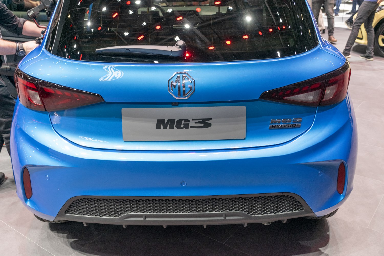 Rear blue hybrid hatchback with MG emblem and sleek taillights