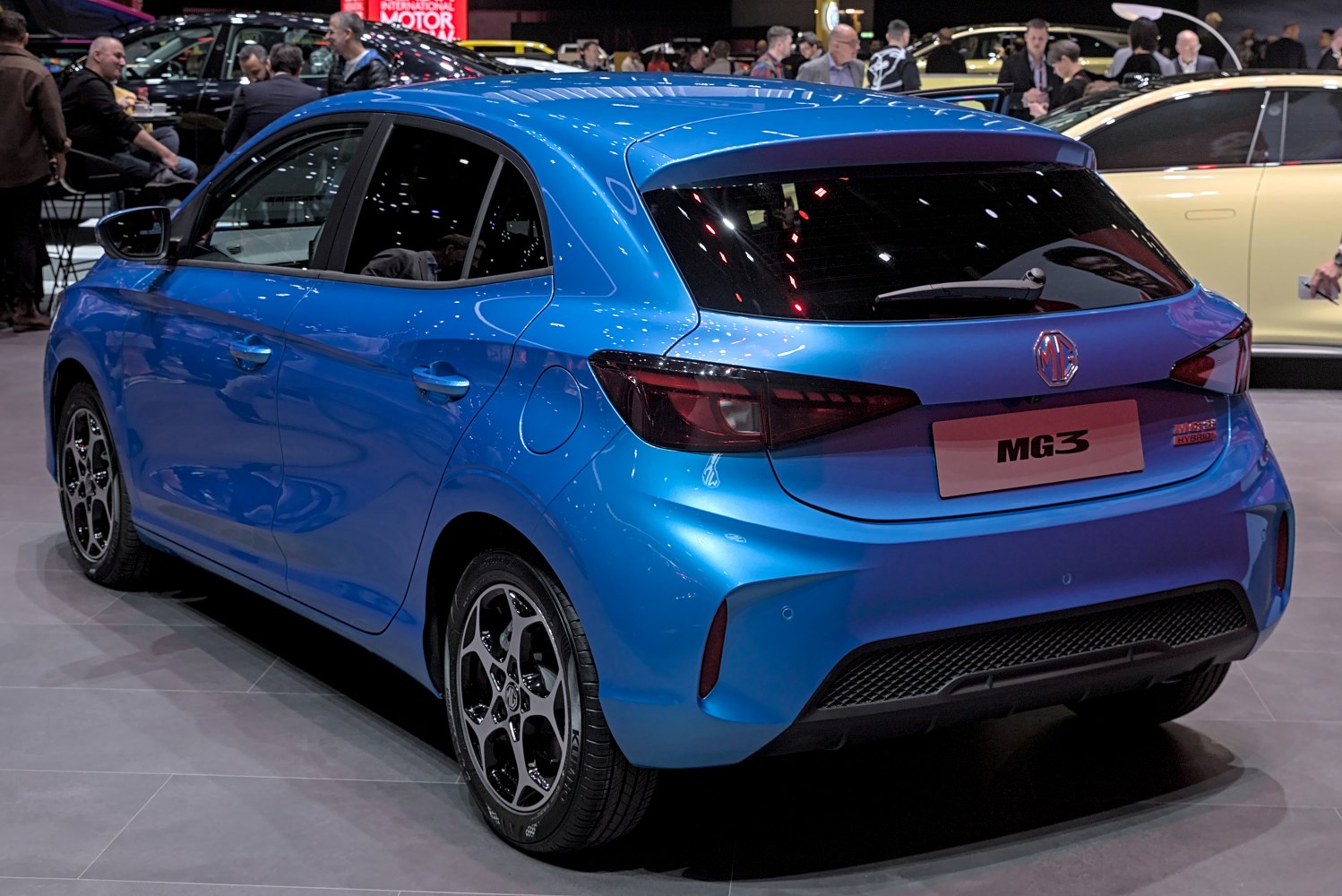 Blue compact hatchback rear with tinted taillights and sporty alloy wheels