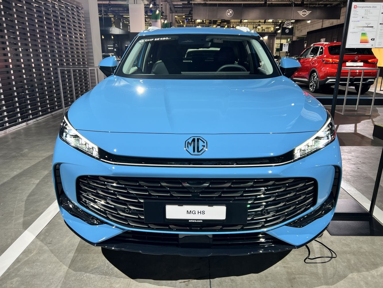 Front view with prominent grille and LED headlights