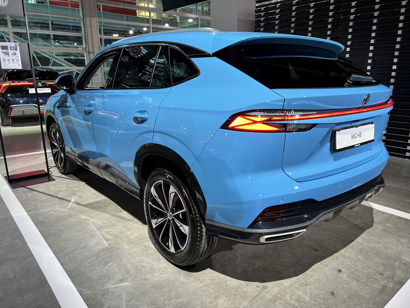 Rear side view showing LED tail lights and aerodynamic rear design.