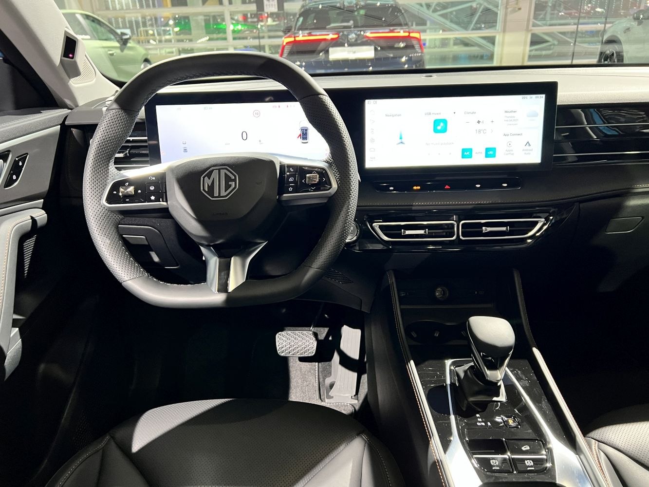 Digital instrument cluster and infotainment touchscreen with modern steering controls