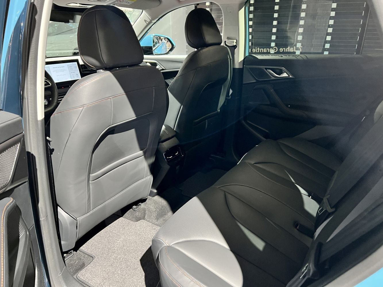 Rear passenger seats with leather upholstery and spacious cabin