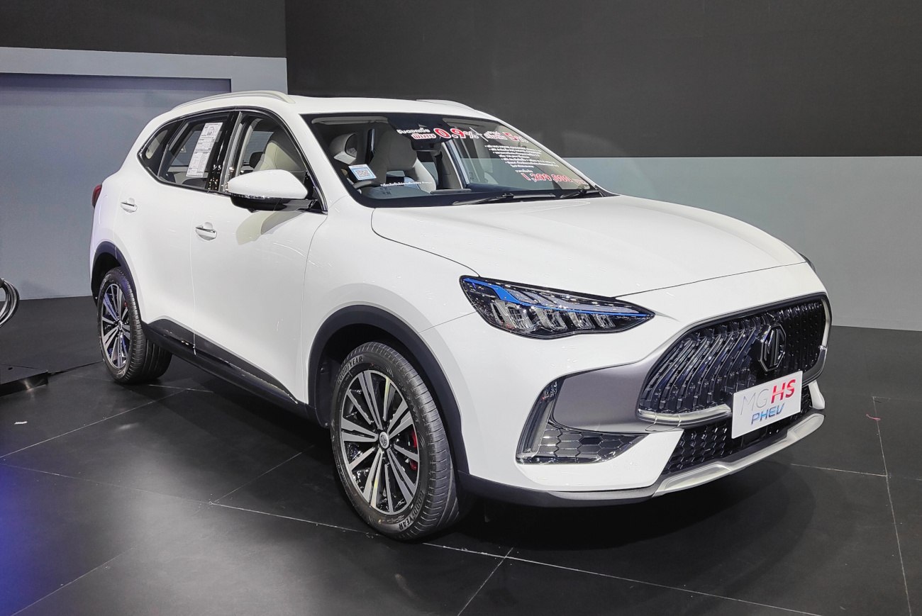 Front-side view showing sleek grille and distinctive modern headlights