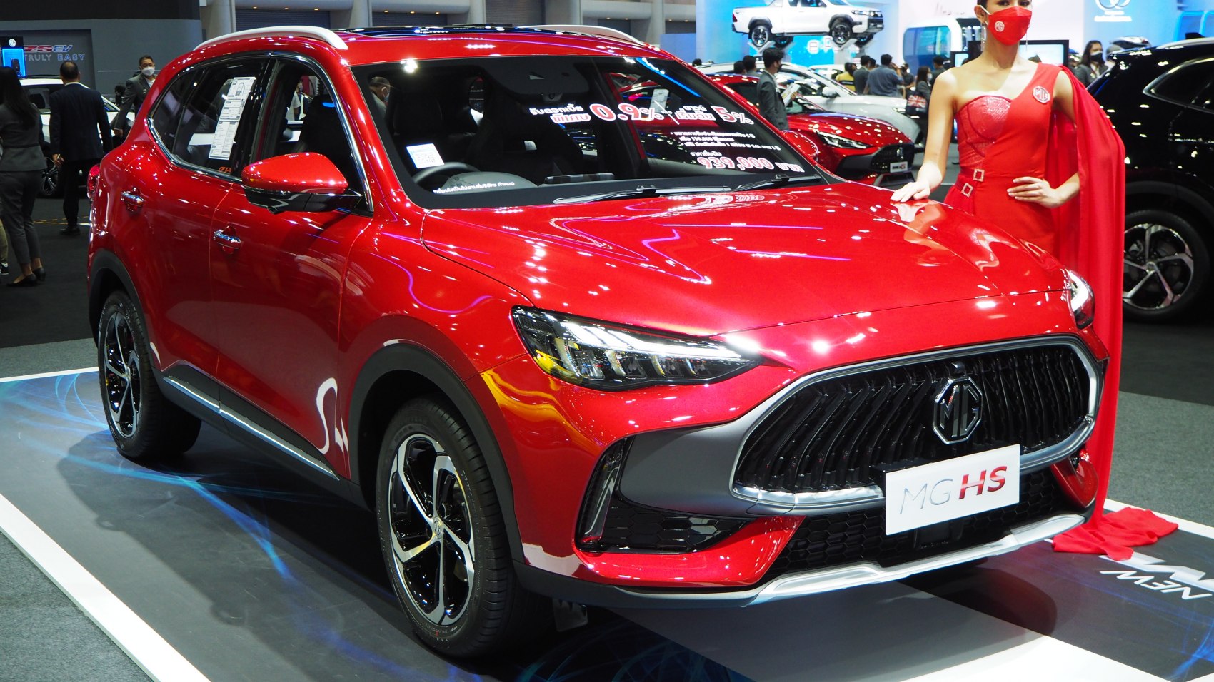Red SUV with distinctive front grille and sleek LED headlights