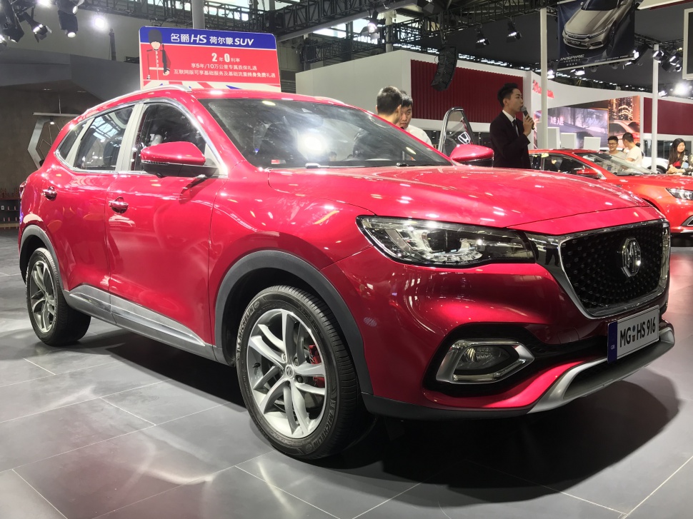 Red SUV with front grille and sporty alloy wheels