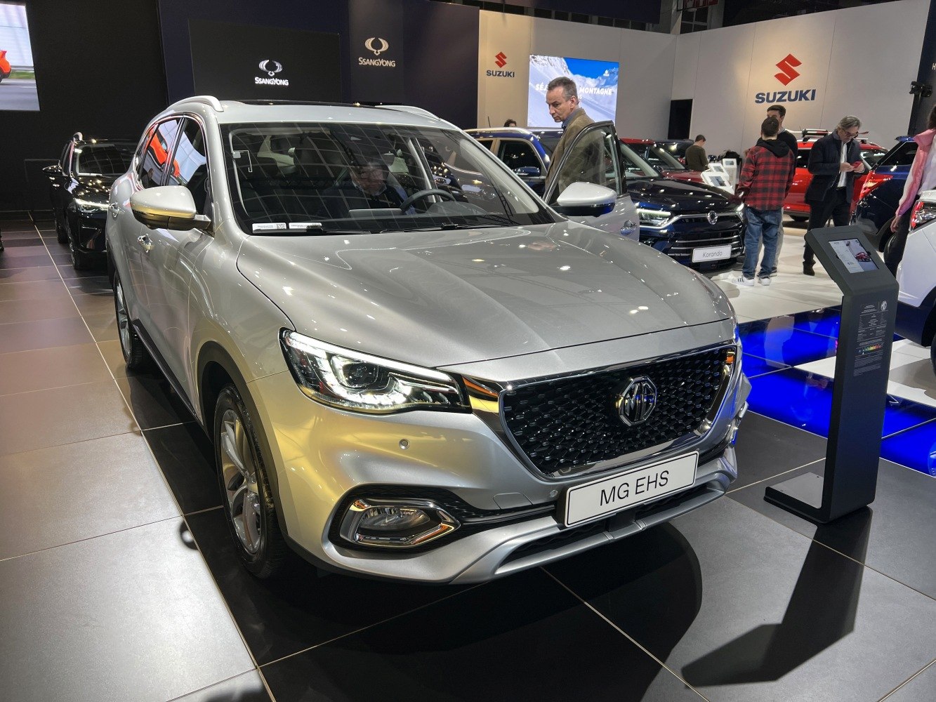 Silver SUV front with LED headlights and black mesh grille