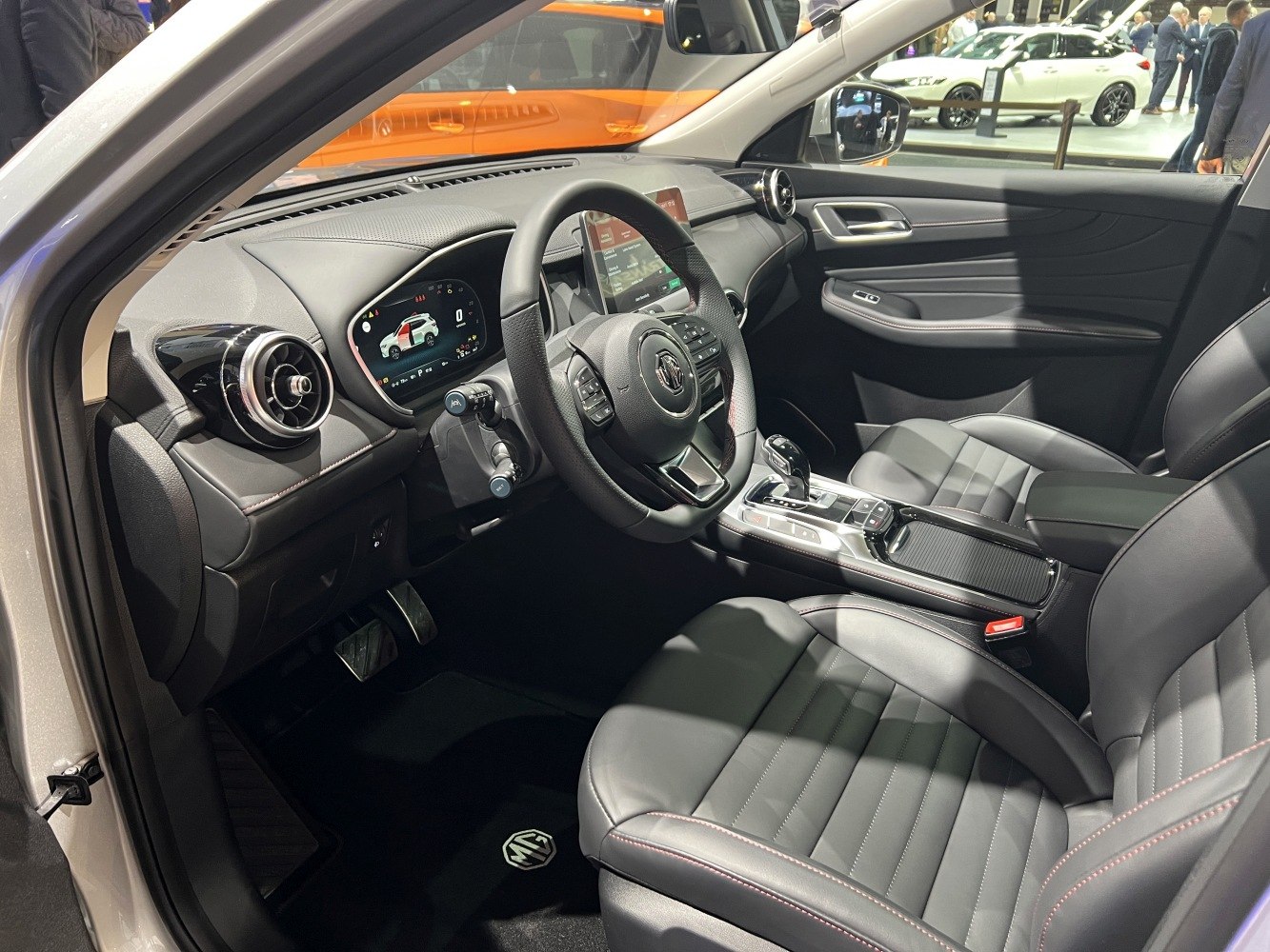 Digital instrument cluster, touchscreen infotainment, leather seats, and modern dashboard