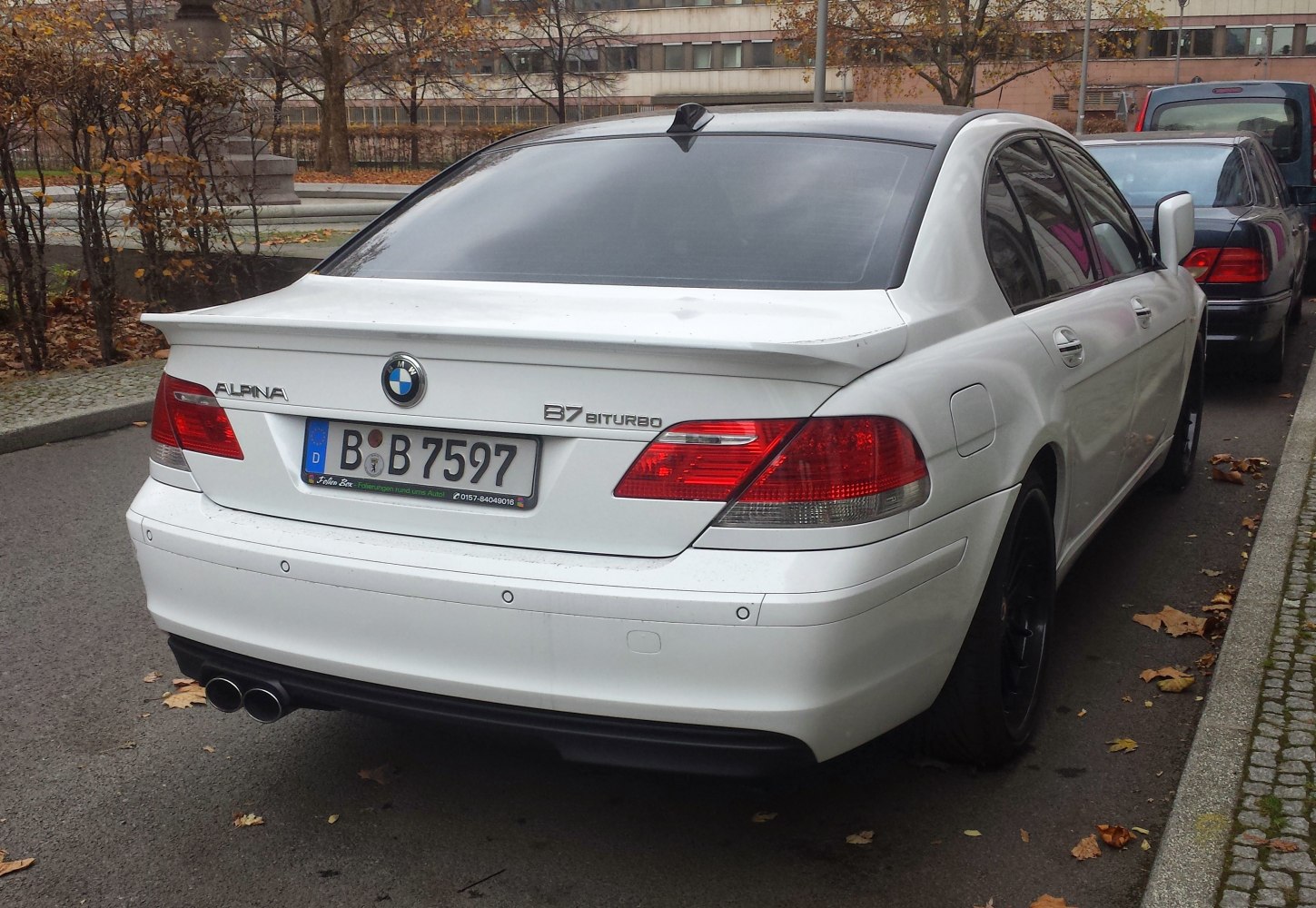 Rear spoiler, quad exhaust, tinted windows, parking sensors